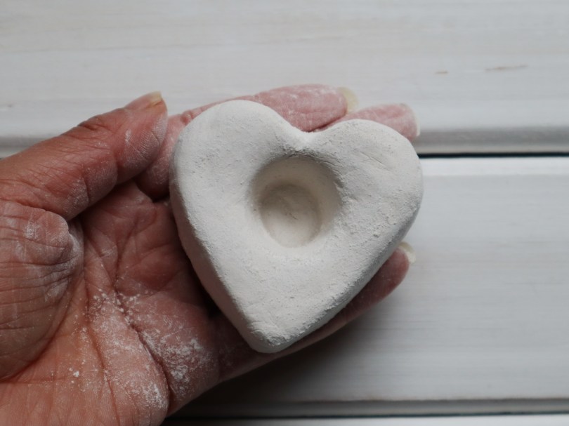 Clay candle holder sanding