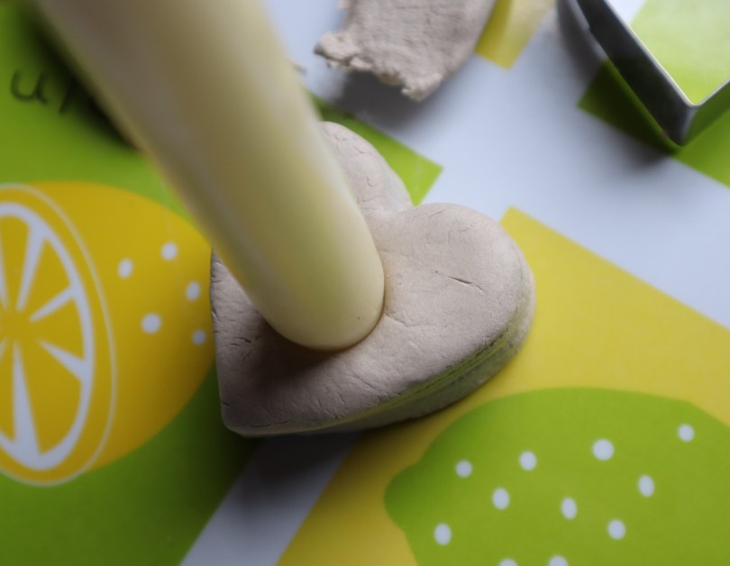 Clay candle holder making candle hole