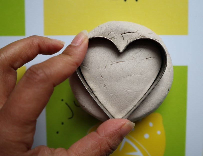 Clay candle holder cutting heart shape
