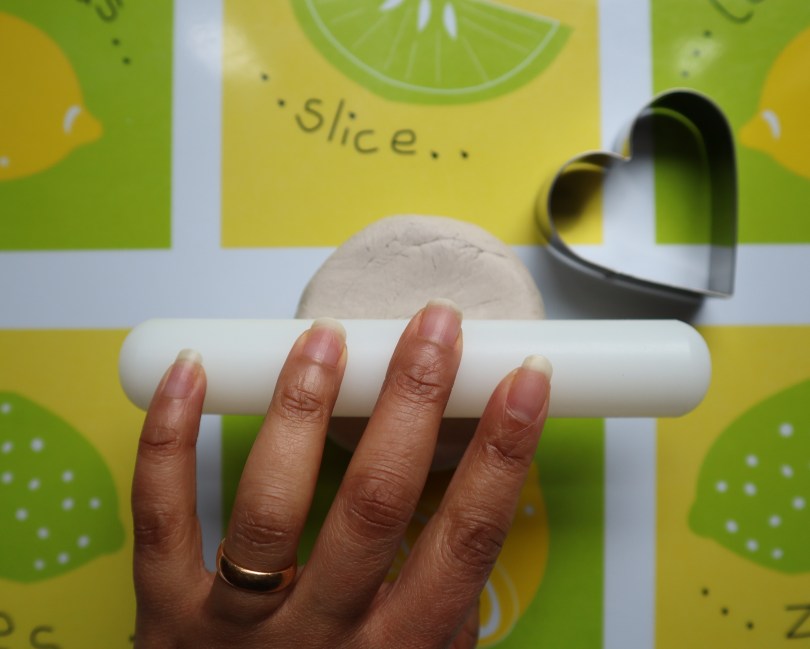 Clay candle holder rolling out